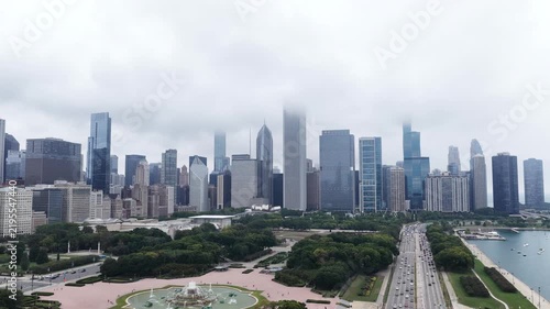 Aerial Drone View of Chicago Skyline, Grant Park, and Lake Shore Drive on a Foggy Day”