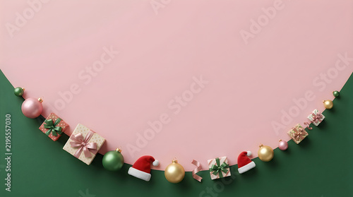 Minimalist Christmas background with festive holiday decorations arranged in a curved border on a dual-tone pink and green surface. Elegant winter seasonal composition featuring small gift boxes