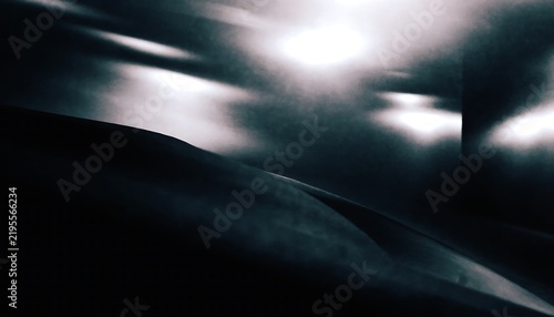 Darkroom inspired abstract photograph with deep black tones and soft glowing light