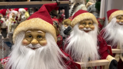 Santa Claus Figurines Close Up Shelf Display in Store | Christmas Holiday Decoration with Glasses and White Beard | Festive Retail Toys
