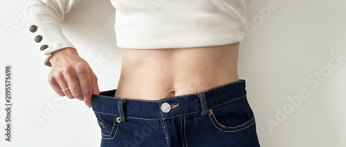Konstfotografi Woman Holding Waistline Over Jeans For Weight Loss Concept