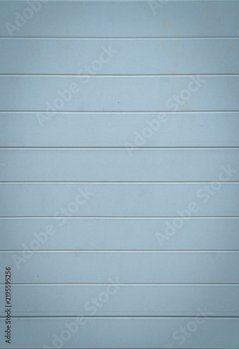 Konstfotografi Light blue horizontal wall panels with evenly spaced lines, creating a clean minimalist geometric background and subtle surface texture