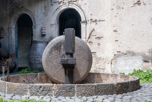 Принти на полотні Close-up of a traditional tahona stone, used for crushing agave in a historic tequila distillery in Tequila