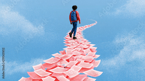 A person with a backpack walks on a winding path made of scattered papers against a blue sky.