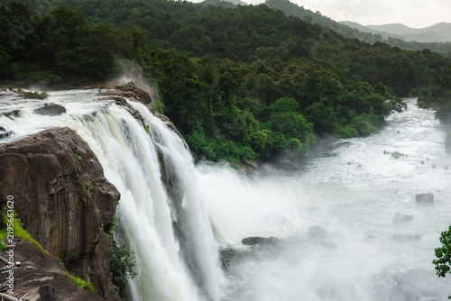 Athirapilly waterfalls surrounded by forest