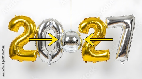 Shiny 2027 foil balloons with a sparkling disco ball on white background
