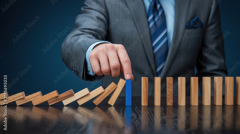 Obraz premium Business leader selecting a blue domino to stop a chain reaction and represent strategic risk