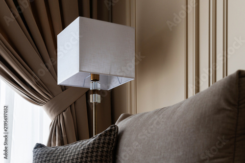 Modern living room interior detail with floor lamp and sofa