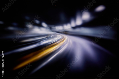 Blurred high speed data flow with glowing light trails and futuristic digital network