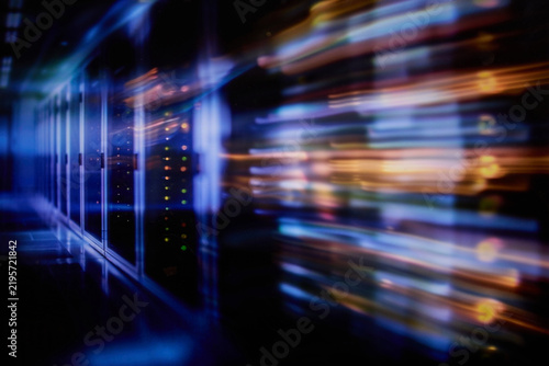 Blurred high speed data flow with glowing light trails and futuristic digital network