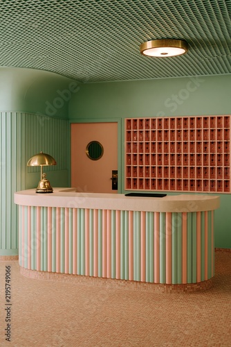 Charming retro boutique hotel reception desk with mint green and pastel pink interior design
