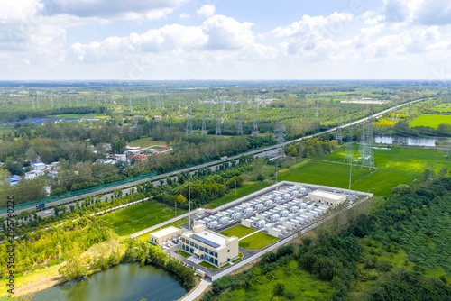 Aerial view of rural high voltage substation and power grid infrastructure