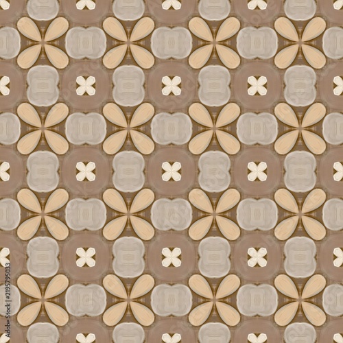 Geometric pattern features repeating beige and brown shapes. Design includes four-petal flowers and cross motifs. Texture suggests soft, tactile fabric or wallpaper surface