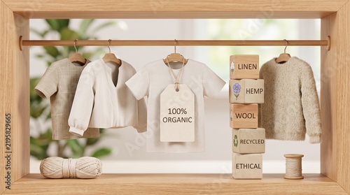 Sustainable organic clothing collection on wooden rack, ethical fashion apparel with 100% organic tag, eco-friendly linen and wool garments