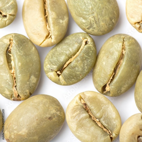 Close Up Raw Green Coffee Beans Scattered on White Background