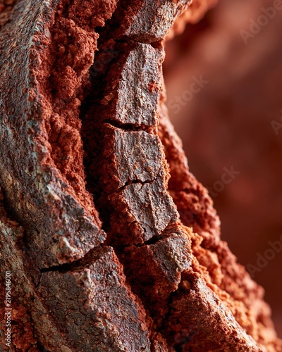 Dry cracked terracotta red clay texture close up arid soil
