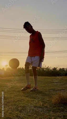 Slow Motion of Silhouette of Soccer Player Practicing at Sunset