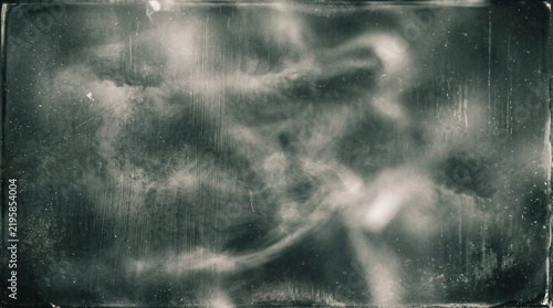 Distressed vintage film frame with grainy cosmic textures and scratched glass effects for antique designs.