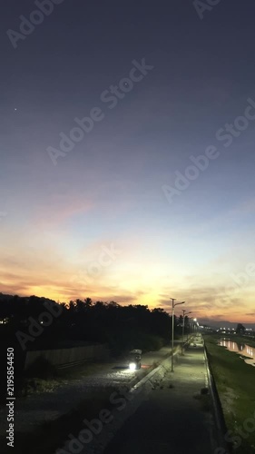 Scenic Sunset Over a Riverside Path