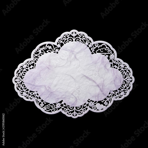 Decorative cloud-shaped paper cutout with ornate lace border