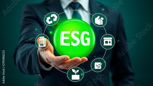 Businessman holding green E S G sphere with environmental icons image