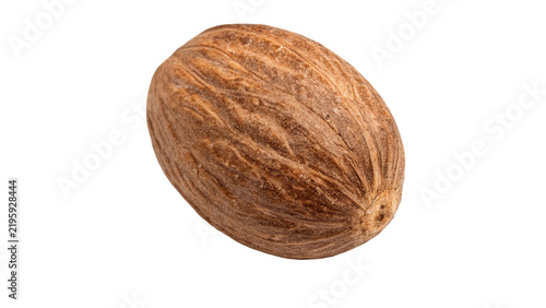 Whole natural raw brown nutmeg seed spice isolated on transparent background.