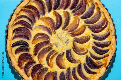 Close-up of a spiral-pattern onion tart
