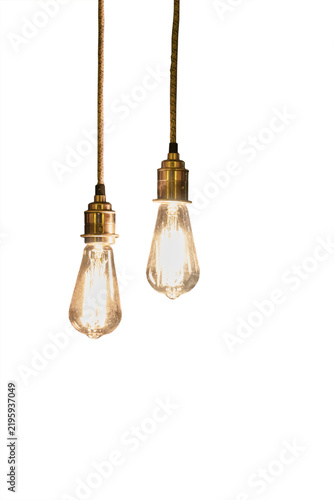 two glowing vintage incandescent bulbs hanging from a cord