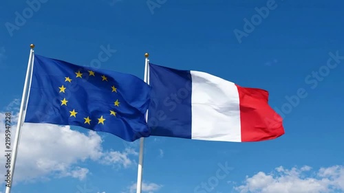European union and france flags waving together against a clear blue sky diplomatic unity and international relations concept