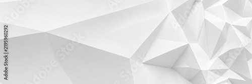 Minimalist white geometric background with low poly 3D triangles. Abstract crystalline texture with soft shadows and sharp edges. Modern architectural surface for clean corporate design.