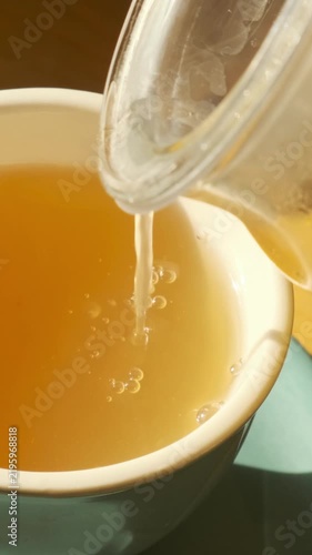 Making hot lemon tea with honey, autumn winter comfort drink, seasonal wellness, warming beverage for cold weather, cozy seasonal moment