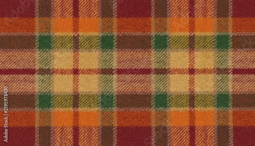 Warm tartan wool fabric in red orange and green, cozy pattern inspired by Scottish heritage, autumn fashion and rustic cabin holiday decor