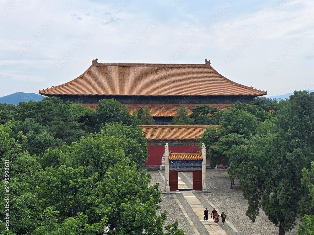 Fototapeta premium Grand imperial hall surrounded by trees at the Ming Tombs near Beijing