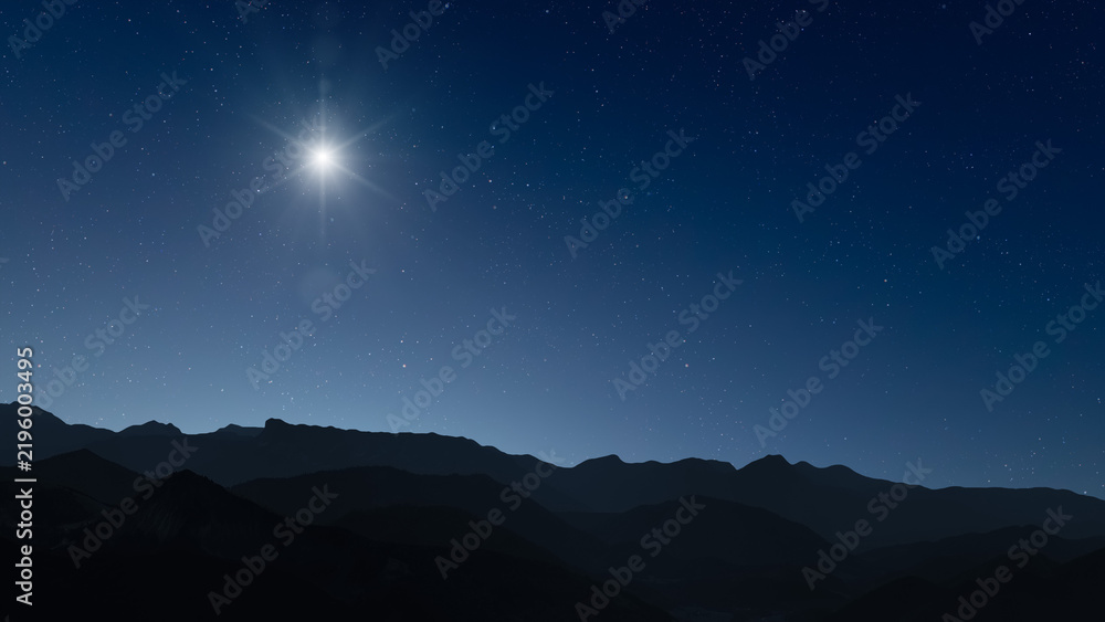 Obraz premium Glowing Christmas star above a peaceful mountain landscape