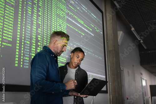 Colleagues Collaborating over Laptop Data Analysis