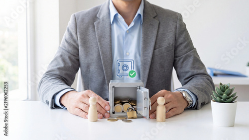 Money safe and savings protection concept. Businessman with open safe full of coins, padlock and wooden figures for family savings, escrow account and safe bank deposit
