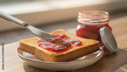 Close Up of Toast with Strawberry Jam on Plate Morning Breakfast