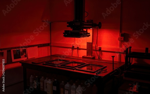 Empty Darkroom, Red Safelight Enlarger Developing Trays Blank Prints