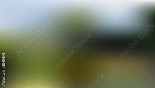 Fotografía Blurred green and white abstract background with indistinct shapes and colors