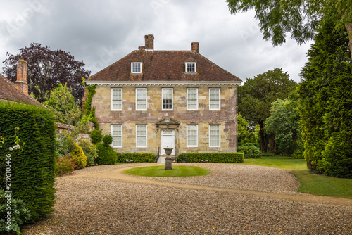 Traditional English manor house with gravel driveway