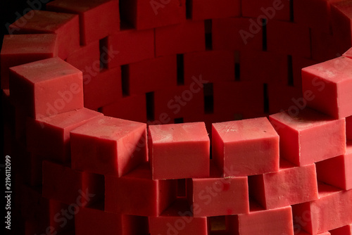 Rows of handmade red soap bars dry in wooden molds at a traditional workshop, North Governorate, Tripoli, Lebanon