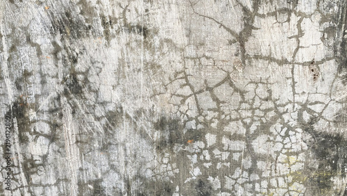 Heavily cracked weathered grey cement wall surface texture