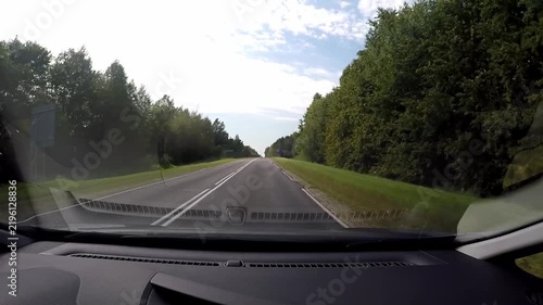 POV Driving Through Green Forest on Rural Road in Belarus.