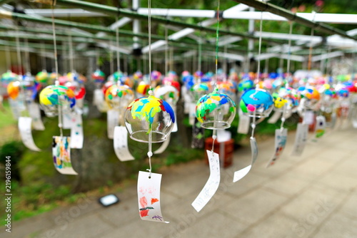 Konstfotografi Colorful Japanese glass wind chimes hanging outdoors in summer