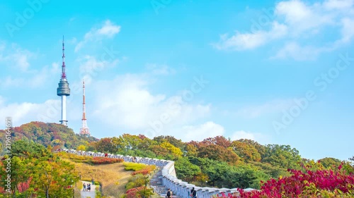 4K Time lapse of beautiful autumn season in Seoul city South Korea with clear blue sky and moving clouds and colorful fall foliage trees in outdoor.