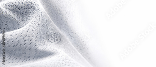 Snowy textured surface with faint snowflake icon, ideal for winter backgrounds