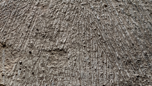 Quadro su tela Close-up of a textured surface with a rough uneven pattern resembling dry cracked earth or a weathered natural material