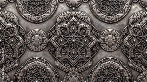 Intricate silver filigree metal pattern with embossed geometric star motifs
