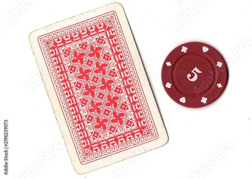 Photography A vintage playing card and poker chip isolated on a white background
