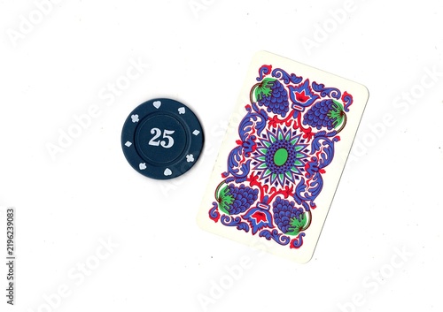 Photography A vintage playing card and poker chip isolated on a white background